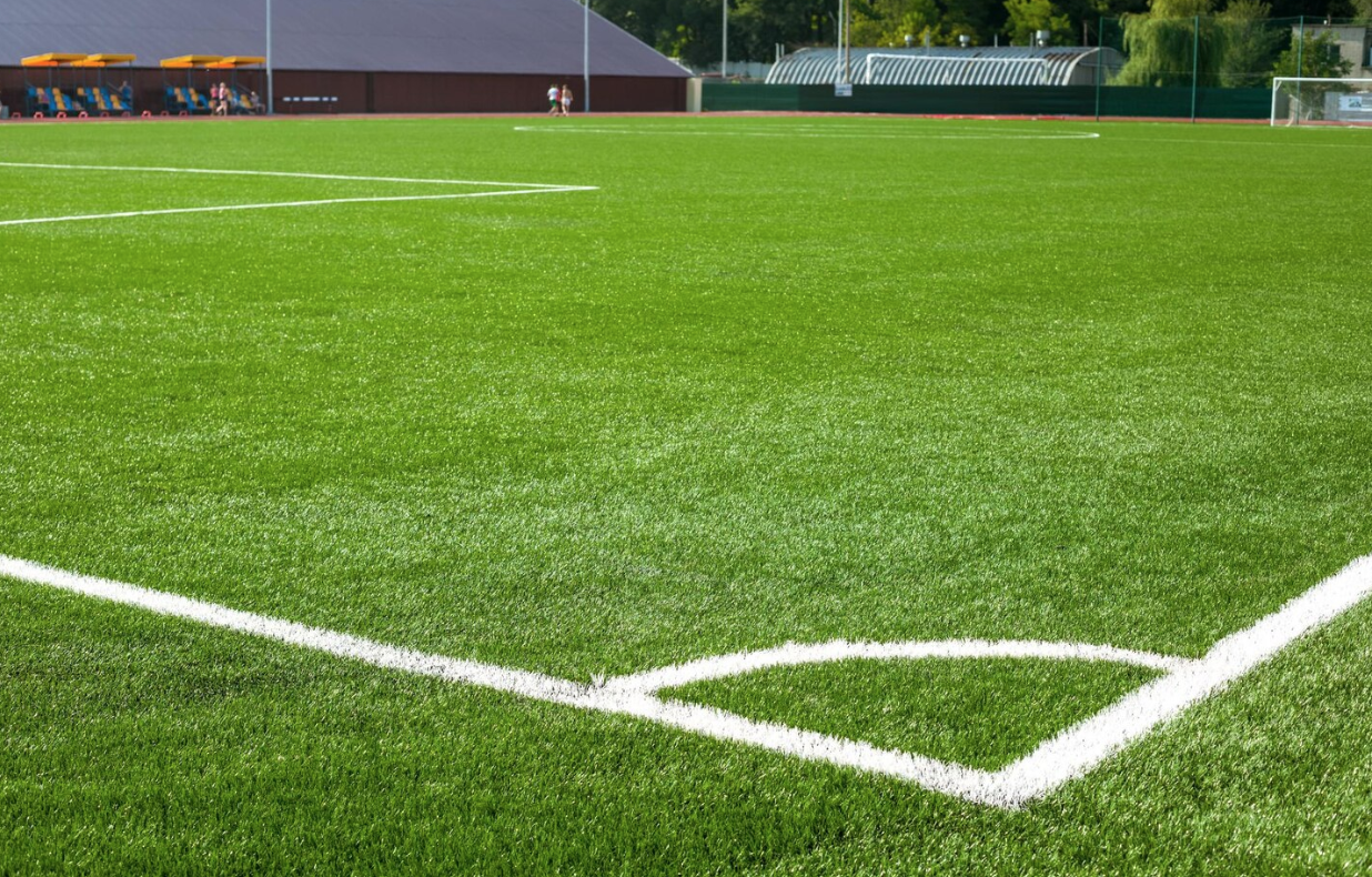 Football soccer field corner with white marks