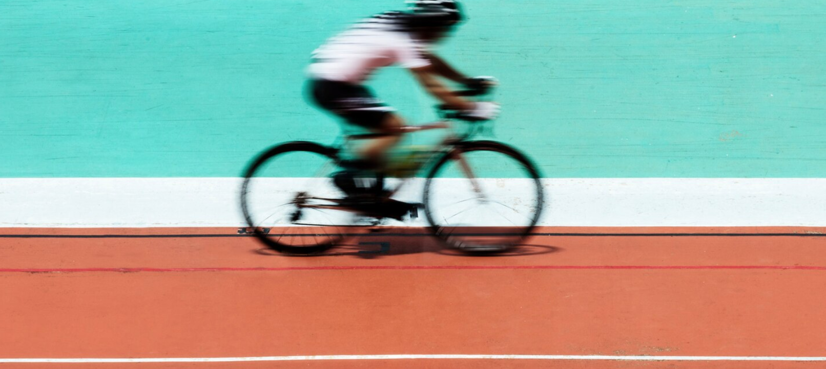 Cyclist biking at a stadium